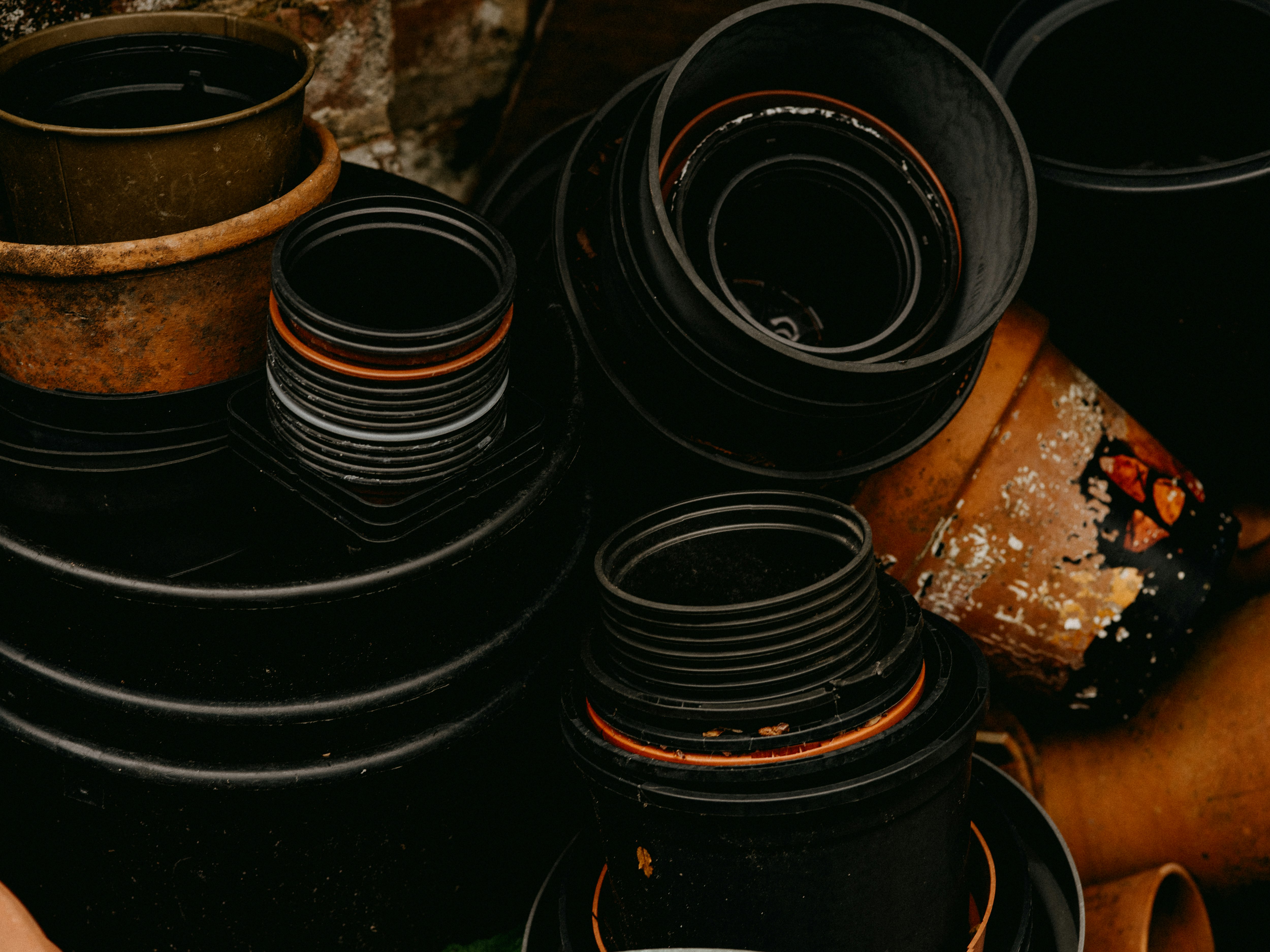 black and brown round metal containers